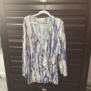 Wrap style top with silver buckle, polyester and spandex, wash gentle cycle